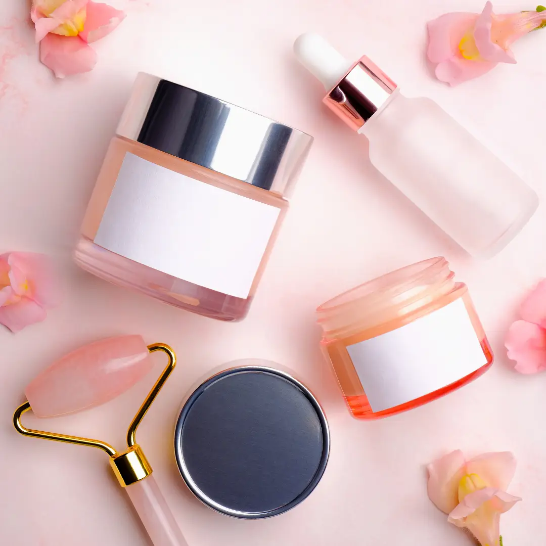 A pink table with some beauty products on it