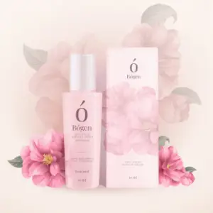 A bottle of lotion and box with flowers