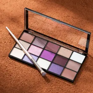 A close up of an open makeup palette